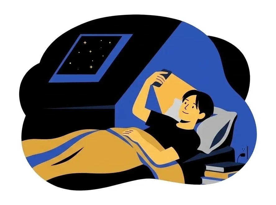 Jun lying in bed under a slanted roof window, holding his phone above his face, a charger plugged in by the bed