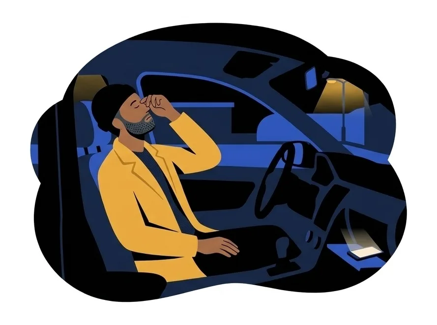 Ravi sitting in the driver’s seat of a car at night, rubbing his eyes, a phone lit up in the glove box